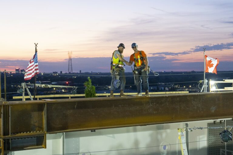 Iron workers shaking hands