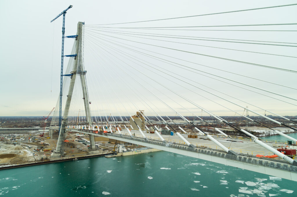 image of bridge with ice floating in the river