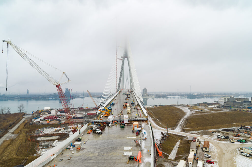 Icy full site construction site with clouds around mast