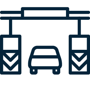 Car in inspection lane icon representing the six bridge lanes, sixteen toll lanes and sixty inspection lanes.